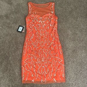 Orange beaded dresss with sheer on top